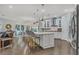 Bright, spacious kitchen features a large island with bar seating, stainless steel appliances, and modern finishes at 307 Morning Marsh Ln, Charleston, SC 29492