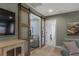 Stylish living room with sliding barn doors, media center, and neutral decor at 307 Morning Marsh Ln, Charleston, SC 29492