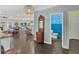 Open-concept living room, kitchen, and bathroom with dark floors and modern lighting at 307 Morning Marsh Ln, Charleston, SC 29492