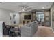 Comfortable living room with a ceiling fan and sliding barn doors to the office at 307 Morning Marsh Ln, Charleston, SC 29492
