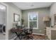 Functional home office space with natural light, desk, and view into laundry room at 307 Morning Marsh Ln, Charleston, SC 29492