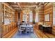 Stylish wood-paneled office with custom built-ins, multiple workstations, and an elegant chandelier at 307 Morning Marsh Ln, Charleston, SC 29492