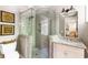 Bathroom with tiled glass shower and granite-topped vanity at 3125 Privateer Creek Rd, Seabrook Island, SC 29455