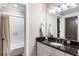 Bathroom featuring granite countertop, white cabinets, and subway tile shower at 3125 Privateer Creek Rd, Seabrook Island, SC 29455
