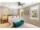 Cozy bedroom with serene decor, two large windows, and natural light at 3125 Privateer Creek Rd, Seabrook Island, SC 29455