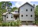 Attractive two-story home with gray siding, black-trim windows, and a two-car garage at 3125 Privateer Creek Rd, Seabrook Island, SC 29455