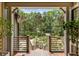Inviting front porch offering scenic views of the surrounding greenery and landscaped yard at 3125 Privateer Creek Rd, Seabrook Island, SC 29455