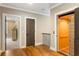 Hallway with hardwood floors, an elevator, and access to a bedroom at 3125 Privateer Creek Rd, Seabrook Island, SC 29455