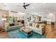 Open-concept living room featuring hardwood floors, comfortable seating, and a view into the modern kitchen at 3125 Privateer Creek Rd, Seabrook Island, SC 29455