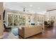 Bright living room featuring hardwood floors, comfortable seating, and glass doors leading to the outside at 3125 Privateer Creek Rd, Seabrook Island, SC 29455