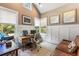 Bright home office with wainscoting, hardwood floors, and a view of the outdoors at 3125 Privateer Creek Rd, Seabrook Island, SC 29455
