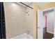 Bathroom shower area with tiled walls and bathtub adjacent to another room at 3284 Sassy Dr, Johns Island, SC 29455