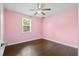 Charming bedroom with hardwood floors, ceiling fan, natural light, and a soothing color palette at 3284 Sassy Dr, Johns Island, SC 29455