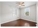 Inviting bedroom with ceiling fan, natural light, hardwood floors, and built-in shelving at 3284 Sassy Dr, Johns Island, SC 29455