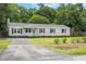Charming single story home with grey siding, black shutters and well maintained front lawn at 3284 Sassy Dr, Johns Island, SC 29455