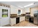 Kitchen featuring white cabinets, stainless steel appliances, and tile flooring at 3284 Sassy Dr, Johns Island, SC 29455