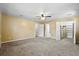 Expansive main bedroom featuring neutral walls, plush carpet, ceiling fan, and ample closet space at 3284 Sassy Dr, Johns Island, SC 29455