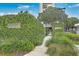 Welcoming entrance to the Dockside community with lush greenery and secure gate at 330 Concord St # 12C, Charleston, SC 29401