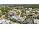 Expansive aerial view showcasing a neighborhood with mature trees, varied architectural styles, and community features at 371 Bridgetown Pass, Mount Pleasant, SC 29464