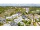 Picturesque aerial view displays a waterside neighborhood with diverse home styles, lush greenery, and serene water views at 371 Bridgetown Pass, Mount Pleasant, SC 29464