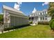 Expansive backyard featuring lush lawn and attractive home architecture at 371 Bridgetown Pass, Mount Pleasant, SC 29464