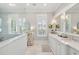 Bright bathroom with marble counters, double sinks, soaking tub and walk-in shower at 371 Bridgetown Pass, Mount Pleasant, SC 29464