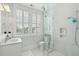 Bright bathroom featuring a glass-door shower, a white vanity, and natural lighting at 371 Bridgetown Pass, Mount Pleasant, SC 29464