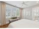 Bedroom with lots of natural light, white walls, bench, and ceiling fan at 371 Bridgetown Pass, Mount Pleasant, SC 29464