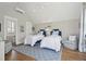 Bright bedroom with two twin beds, stylish decor, and a serene atmosphere at 371 Bridgetown Pass, Mount Pleasant, SC 29464