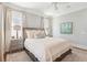 Bright bedroom with king bed, end tables with lamps, art and a plush rug at 371 Bridgetown Pass, Mount Pleasant, SC 29464