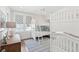 bedroom featuring white bunk beds, a desk, a ceiling fan, and bright rug at 371 Bridgetown Pass, Mount Pleasant, SC 29464