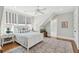Bright bedroom with a queen bed, hardwood floors, ceiling fan and ensuite bathroom at 371 Bridgetown Pass, Mount Pleasant, SC 29464