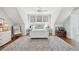 Bright bedroom with a queen bed, hardwood floors, chest, and a ceiling fan at 371 Bridgetown Pass, Mount Pleasant, SC 29464