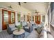 Spacious covered patio featuring comfortable seating arrangements and seamless outdoor living at 371 Bridgetown Pass, Mount Pleasant, SC 29464