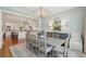 Open dining area connected to the kitchen, with hardwood floors and a spacious table setting at 371 Bridgetown Pass, Mount Pleasant, SC 29464