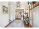 Elegant foyer featuring hardwood floors, a stylish rug, and a view into a spacious living area at 371 Bridgetown Pass, Mount Pleasant, SC 29464