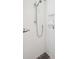 Modern shower featuring white subway tiles, built-in shelving, and sleek fixtures at 371 Bridgetown Pass, Mount Pleasant, SC 29464