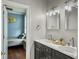 Bright bathroom features a double vanity with marble countertop and decor at 4 Line St, Charleston, SC 29403