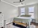 Comfortable bedroom with ample natural light, hardwood floors, and a ceiling fan at 4 Line St, Charleston, SC 29403