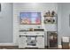 Modern entertainment area with a large screen television, wet bar, and built-in storage at 4 Line St, Charleston, SC 29403