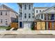 Charming two-story home with a blue exterior, a garage, and a small landscaped front yard at 4 Line St, Charleston, SC 29403