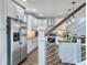 Open-concept kitchen with stainless steel appliances and modern white cabinets at 4 Line St, Charleston, SC 29403