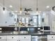 Modern kitchen featuring a breakfast bar, stainless steel appliances and an open view of the living room at 4 Line St, Charleston, SC 29403