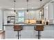 A beautifully appointed kitchen features modern pendant lighting and a breakfast bar at 4 Line St, Charleston, SC 29403