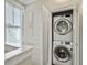 White laundry closet and cabinets adjacent to the staircase at 4 Line St, Charleston, SC 29403