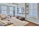 Bright living room with modern decor, including a comfortable sofa, accent pillows, and a stylish entertainment center at 4 Line St, Charleston, SC 29403
