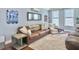 Bright living room with modern decor, including a comfortable sofa, accent pillows, and a stylish entertainment center at 4 Line St, Charleston, SC 29403