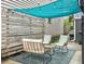 Cozy outdoor patio with shade cover, comfortable seating, and stylish decor at 4 Line St, Charleston, SC 29403