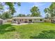 This charming backyard features lush grass, privacy fencing, a patio, and ample space for relaxation and outdoor activities at 402 Woodward Blvd, Summerville, SC 29483