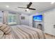 Relaxing bedroom boasts a ceiling fan, neutral colors, and a flat screen television at 402 Woodward Blvd, Summerville, SC 29483